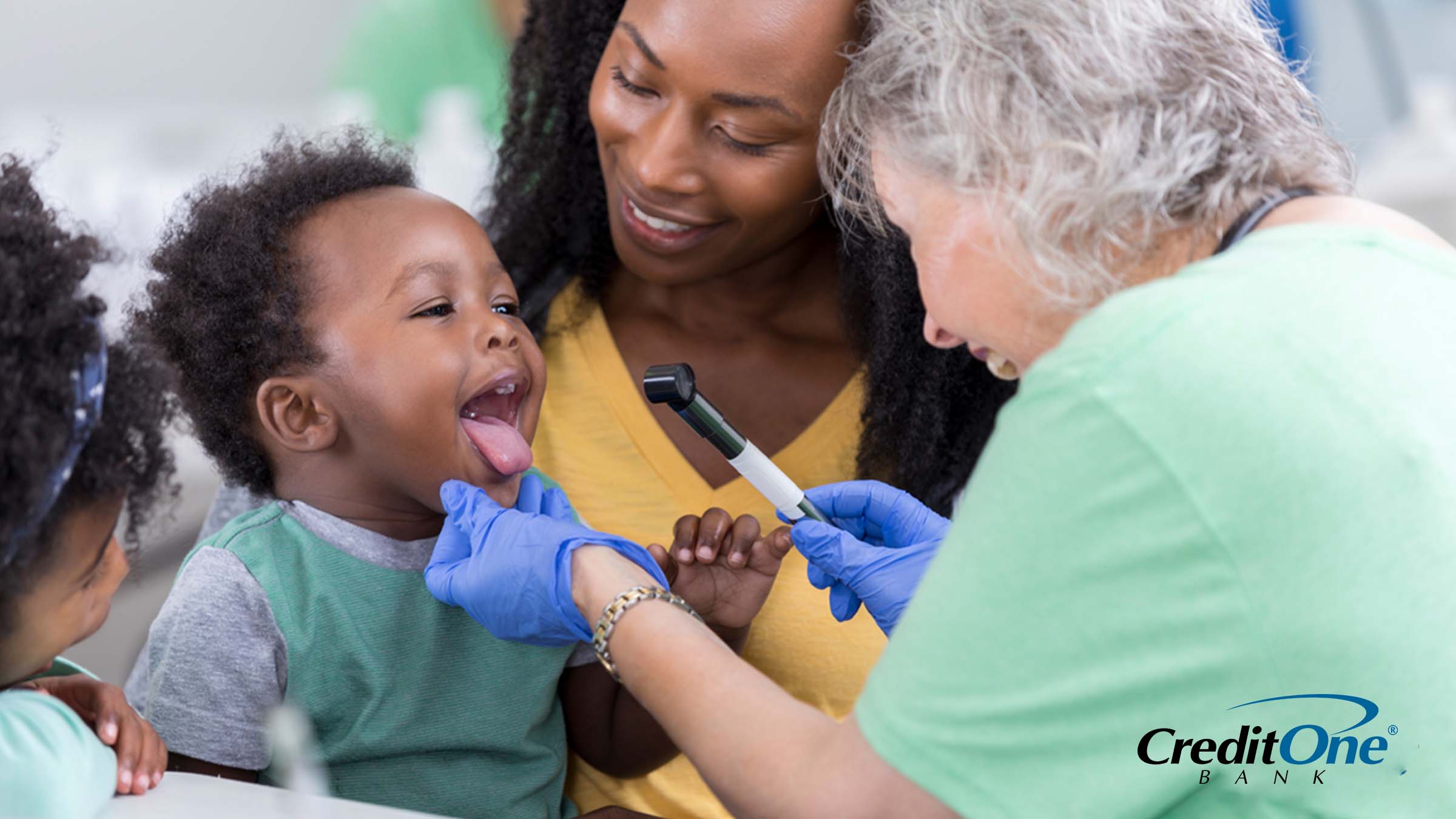 A mother using her health insurance to pay for a health checkup for her toddler